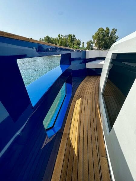 Aicon Audace 50 yacht deck, 2025 model, featuring sleek design and wooden flooring.