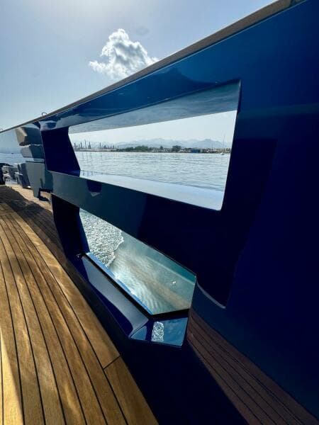 Aicon Audace 50 yacht, 2025 model, sleek design with wooden deck and ocean view.
