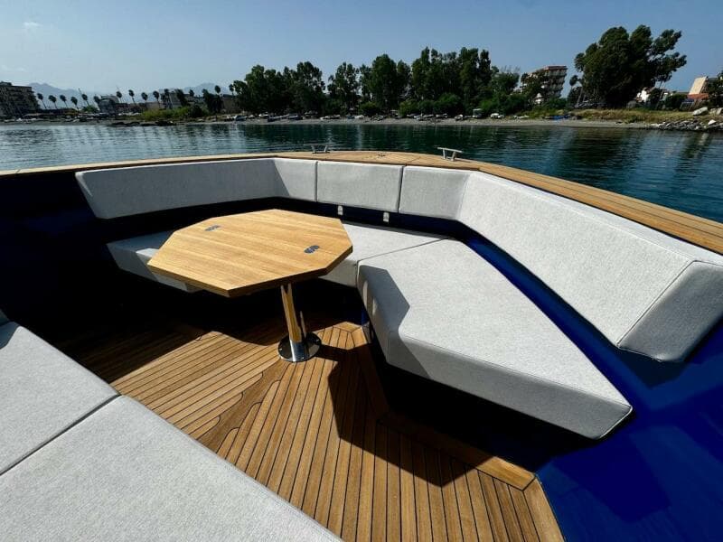 Luxurious 2025 Aicon Audace 50 yacht with elegant seating and wooden deck.