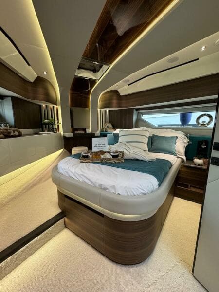 Luxurious bedroom interior of 2024 Aicon 66 Vivere yacht with modern design and ambient lighting.