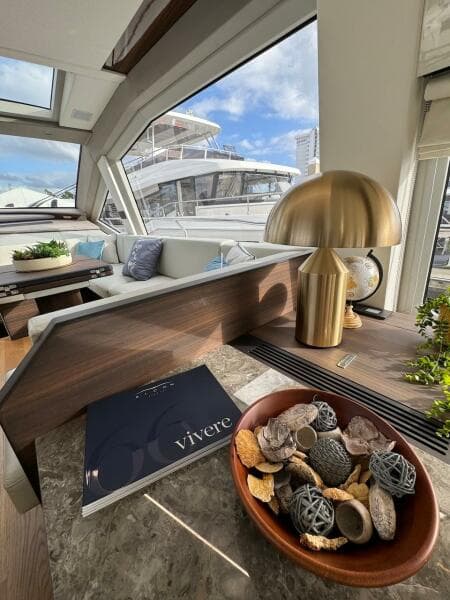 Luxurious interior of 2024 Aicon 66 Vivere yacht with modern decor and scenic view.