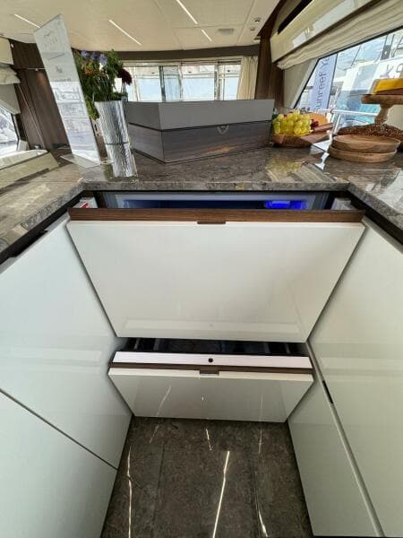 Luxurious interior of 2024 Aicon 66 Vivere yacht with modern kitchen design.