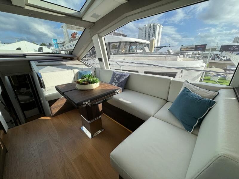 Luxurious interior of 2024 Aicon 66 Vivere yacht with plush seating and modern decor.