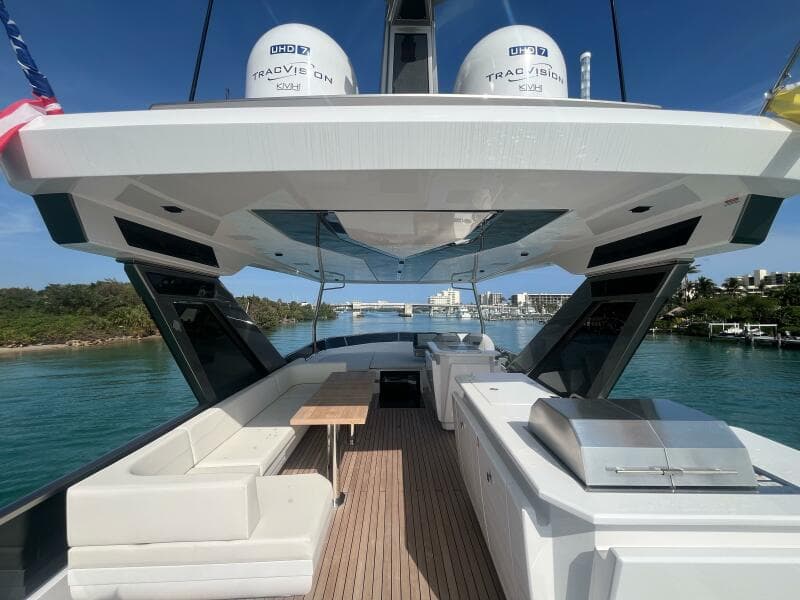 Luxury Aicon 66 Vivere yacht deck, 2024 model, with sleek seating and ocean view.