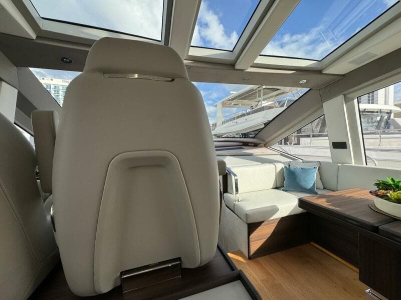Luxurious interior of 2024 Aicon 66 Vivere yacht with skylights and modern seating.