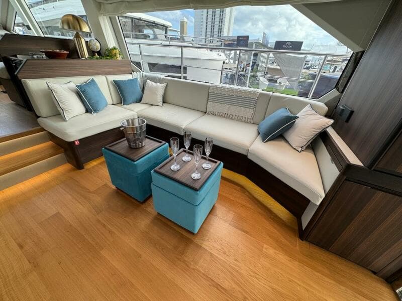 Luxurious interior of 2024 Aicon 66 Vivere yacht with elegant seating and decor.