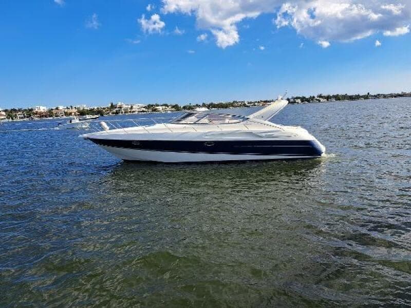 2003 Cranchi Endurance 39 yacht on calm water under a blue sky.