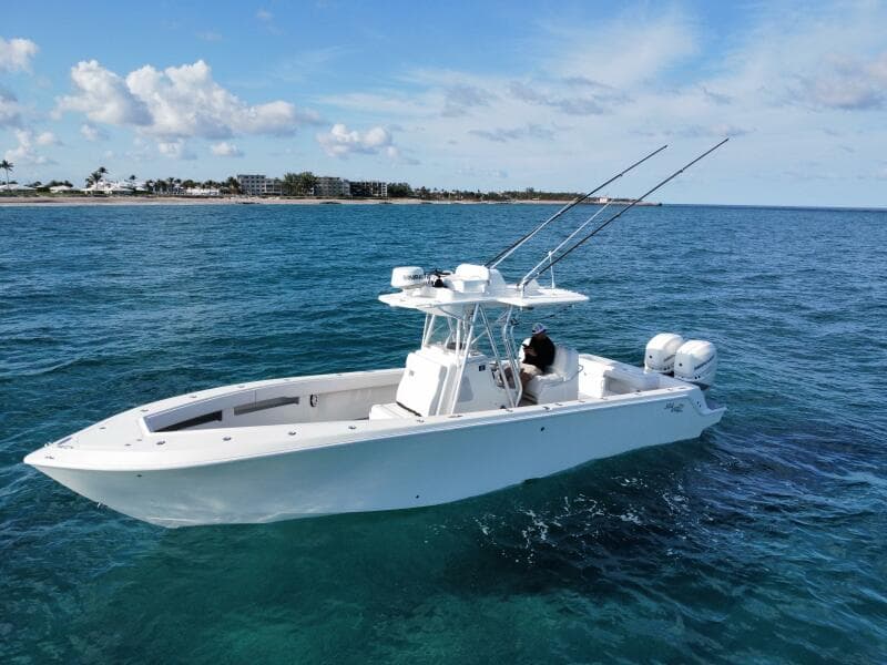 2017 SeaVee 340Z boat on clear blue ocean near coastline.