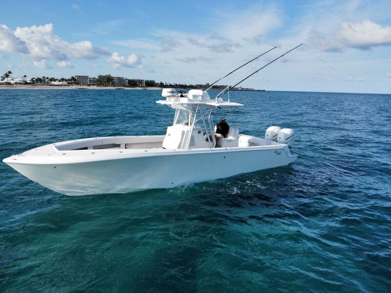 2017 SeaVee 340Z boat on clear blue ocean water, under a partly cloudy sky.