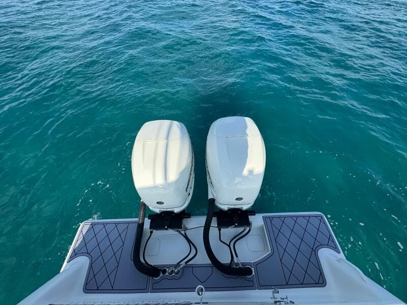 2017 SeaVee 340Z boat with twin outboard engines on clear blue water.