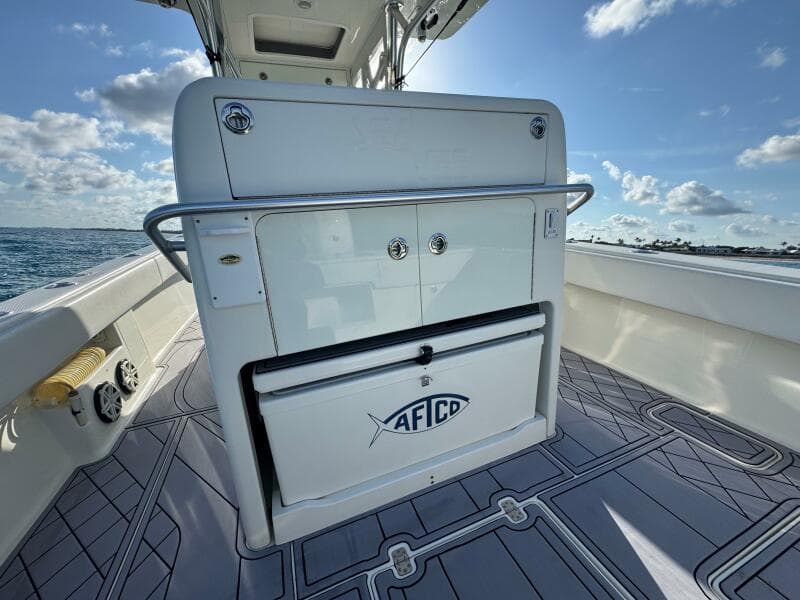 2017 SeaVee 340Z boat interior with storage compartment, ocean view, and clear sky.