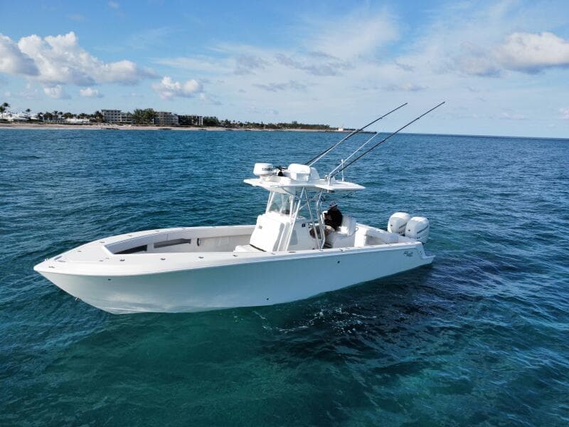 2017 SeaVee 340Z boat on open water, clear sky, fishing rods visible.