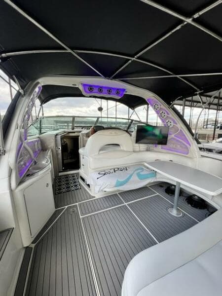 2003 Sea Ray 380 Sundancer yacht interior with modern seating and ambient lighting.