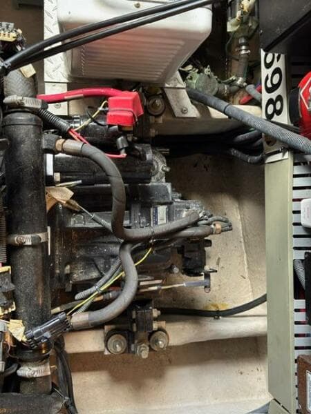 Engine compartment of a 2003 Sea Ray 380 Sundancer boat, showcasing mechanical components.