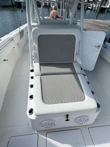 2020 SeaHunter 39 Tournament boat with cushioned seating and rod holders, docked at marina.