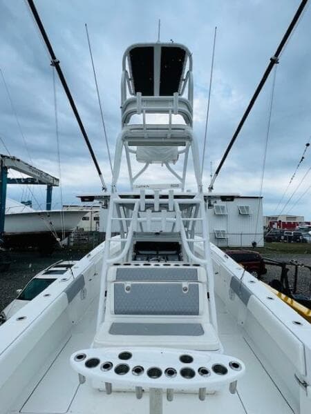 2020 SeaHunter 39 Tournament boat with tower and rod holders, docked under cloudy skies.