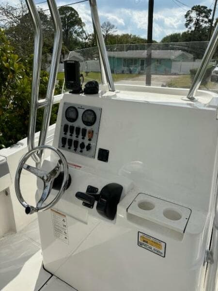 2016 Release 208 RX boat console with steering wheel and control panel.