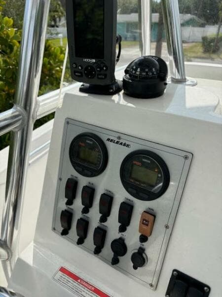 Control panel of a 2016 Release 208 RX boat with gauges and navigation equipment.
