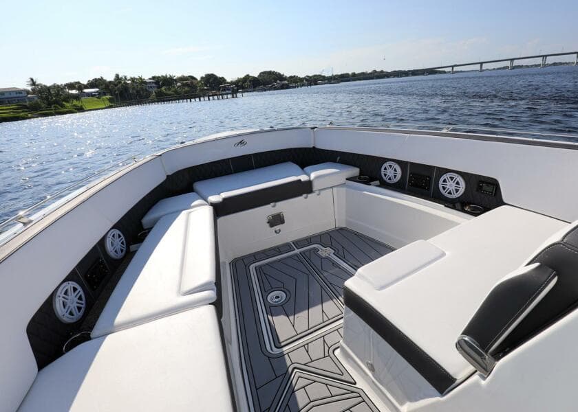 2023 Monterey 385 Super Sport boat interior with luxurious seating and scenic water view.