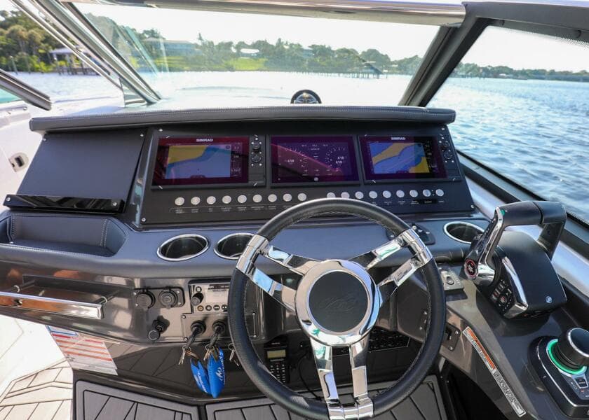 2023 Monterey 385 Super Sport boat dashboard with modern controls and steering wheel.