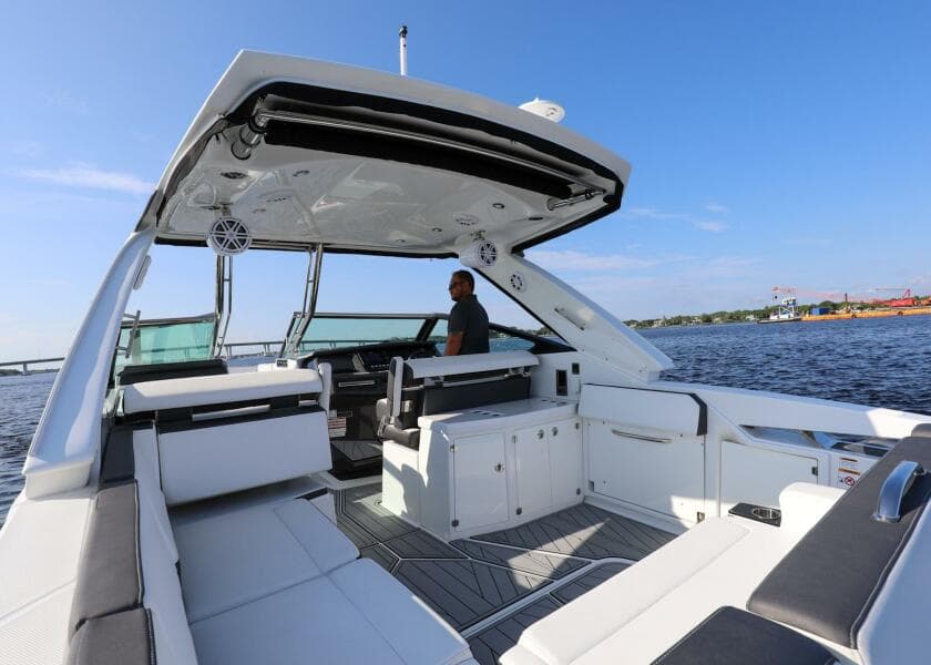 2023 Monterey 385 Super Sport boat interior with seating, helm, and open water view.