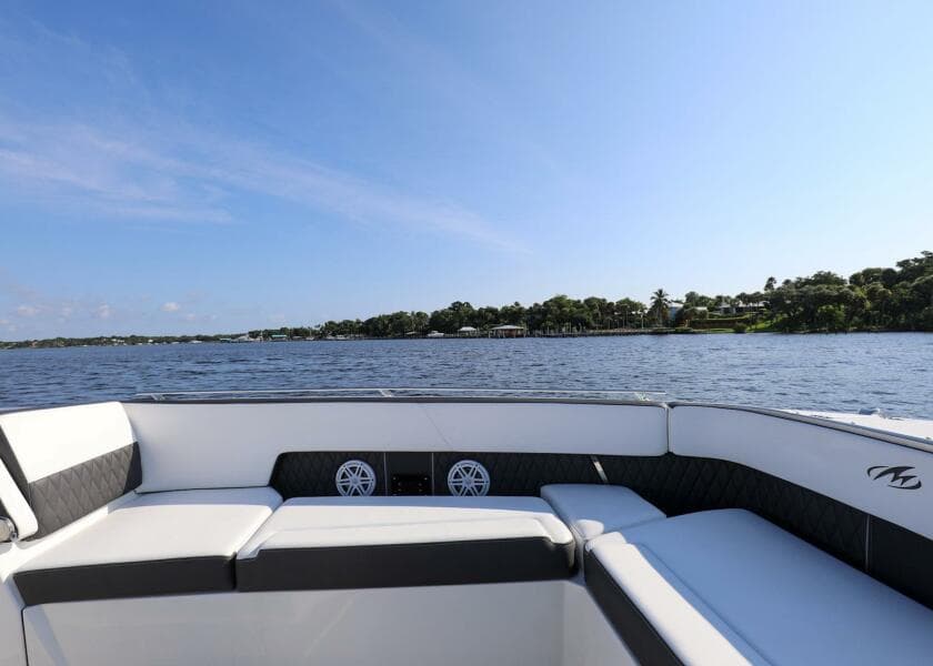 2023 Monterey 385 Super Sport boat interior with lake view and clear sky.