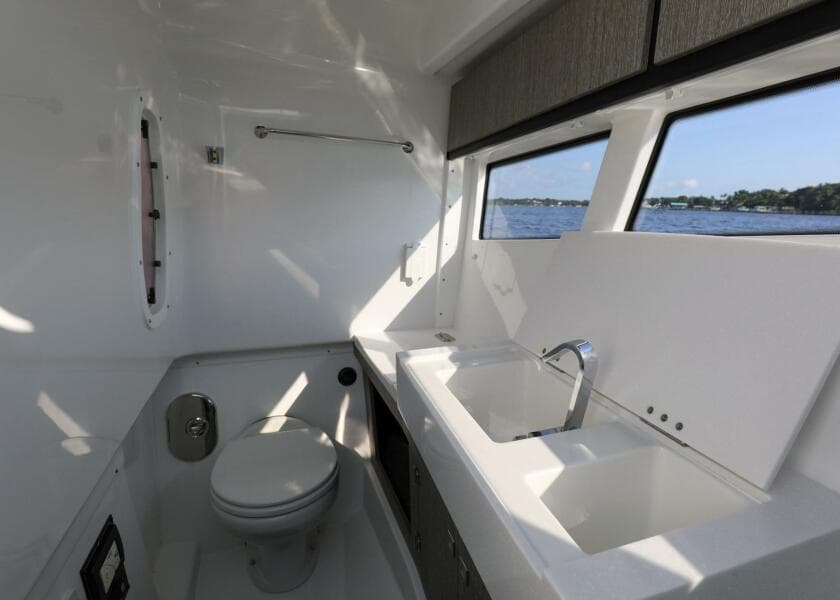 Bathroom interior of 2023 Monterey 385 Super Sport yacht with ocean view.