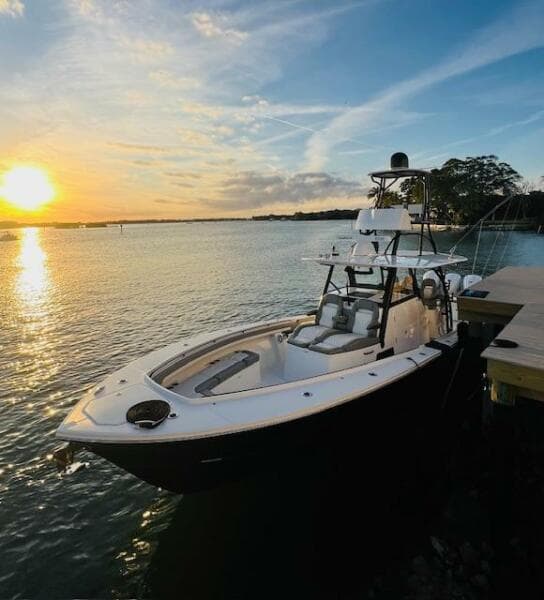 2024 Regulator 41 boat docked at sunset, calm waters, scenic view.