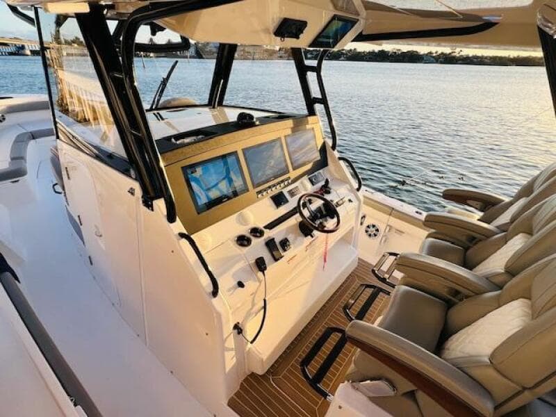 2024 Regulator 41 boat cockpit with advanced navigation screens and luxurious seating.