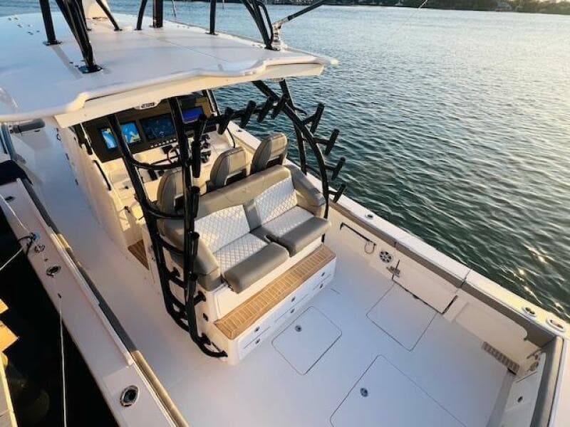 2024 Regulator 41 boat with modern seating and control panel on calm water.