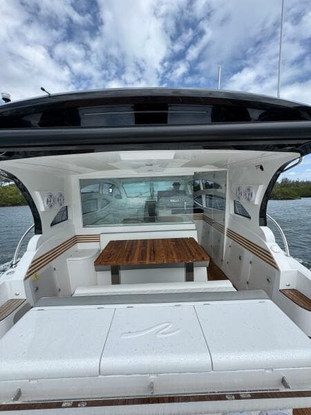 2025 Real 40 HT Luxury yacht with sleek design and spacious seating area.