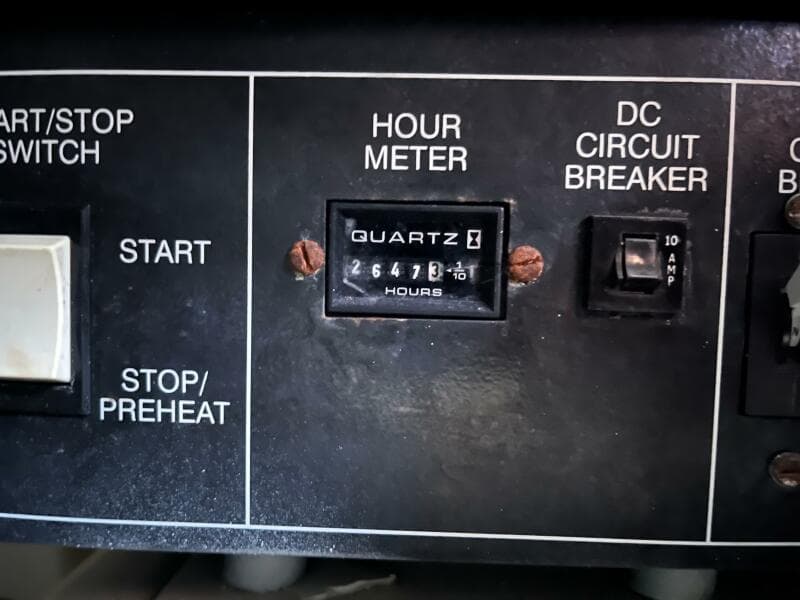 Control panel of 2000 Carver 396 Motor Yacht with hour meter and circuit breaker.