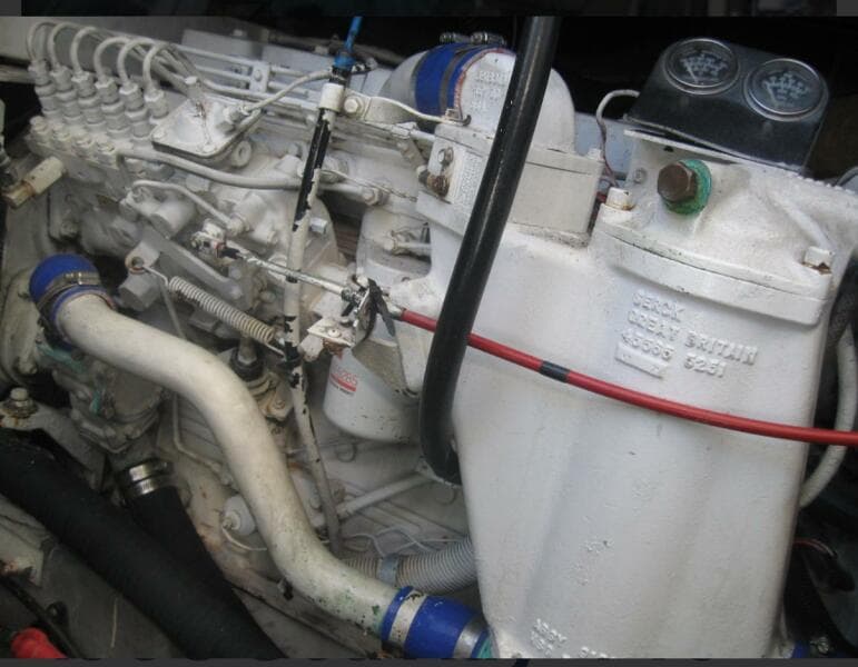 Engine of a 1993 Sea Ray 440 Sundancer boat, showcasing intricate mechanical components.