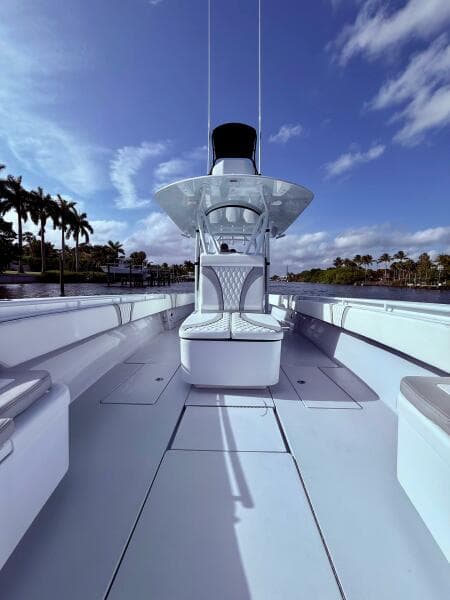 2024 Contender 39 ST boat with sleek design, spacious deck, and modern features under a clear sky.