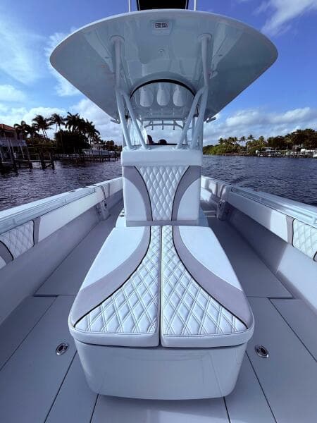 2024 Contender 39 ST boat interior with luxurious seating and sleek design on a sunny day.
