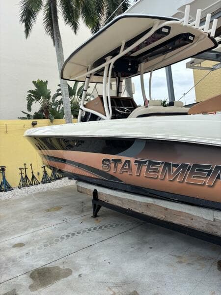 2013 Statement 35 Center Console boat on display, featuring sleek design and bold graphics.