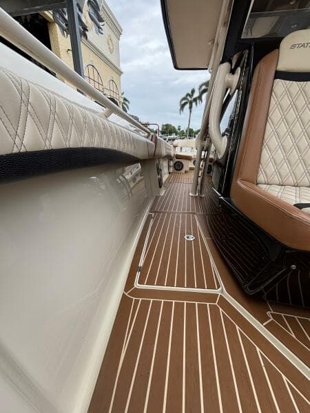 Luxurious interior of 2013 Statement 35 Center Console boat with elegant seating and flooring.