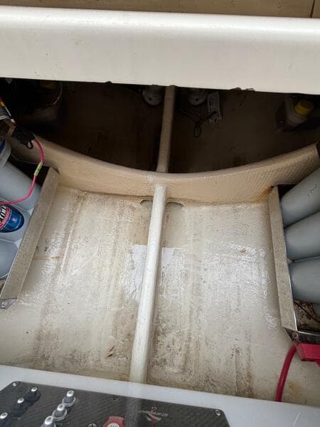 2013 Statement 35 Center Console boat interior with visible wiring and storage compartments.