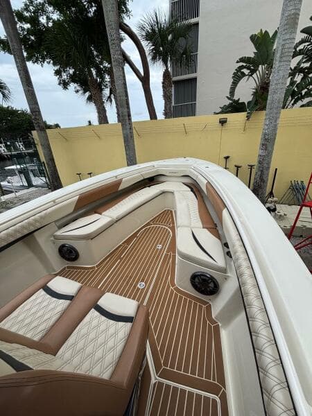 2013 Statement 35 Center Console boat with luxurious seating and teak flooring.