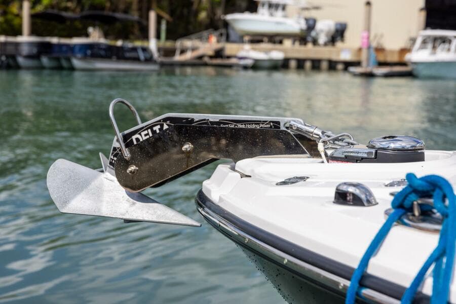 2023 Monterey 255 Super Sport boat with anchor, docked in marina.