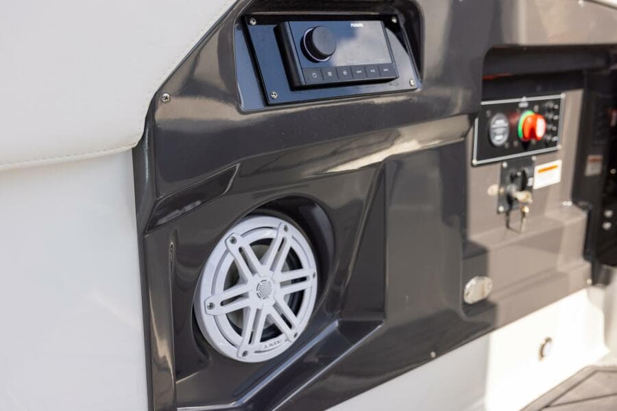 2023 Monterey 255 Super Sport boat dashboard with speaker and control panel.