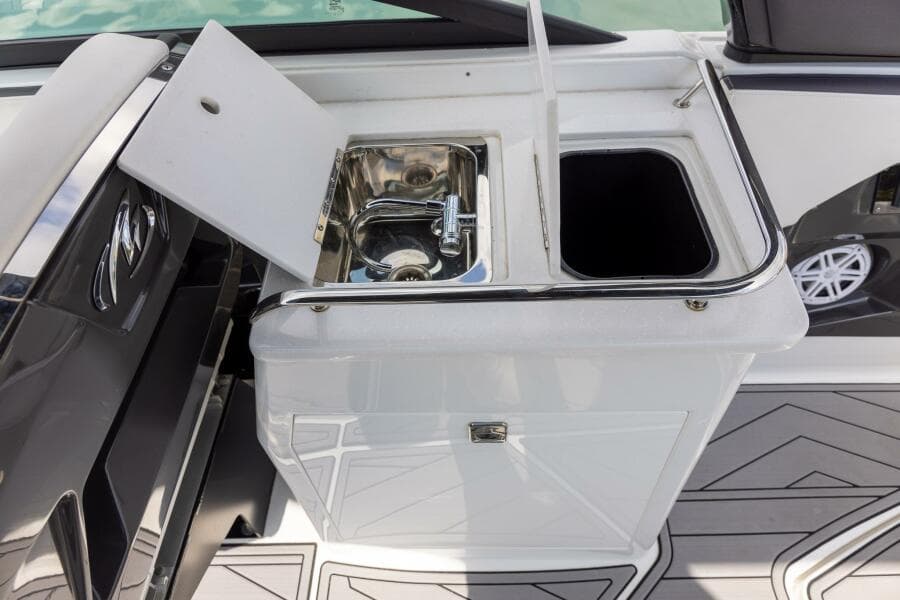 2023 Monterey 255 Super Sport boat sink and storage area.