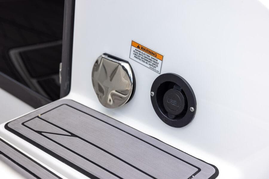 2023 Monterey 255 Super Sport boat detail with warning label and fittings.