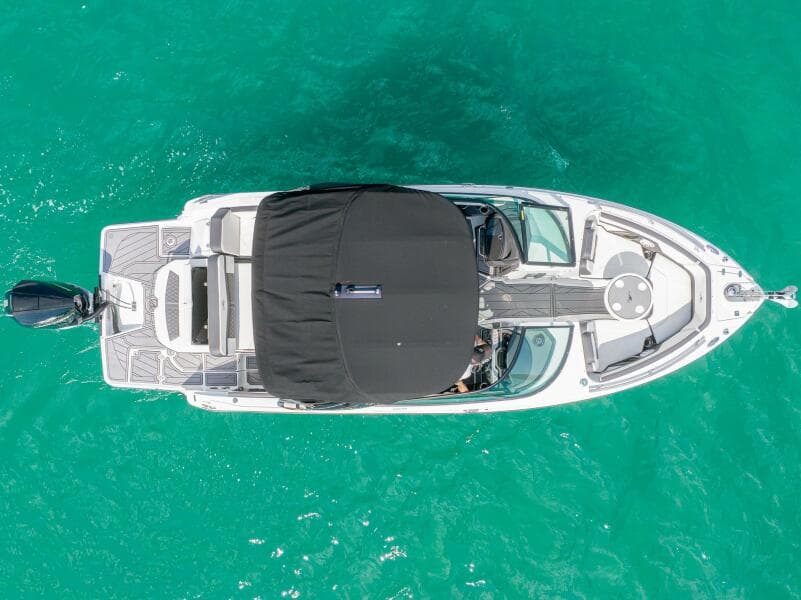 Aerial view of 2023 Monterey 255 Super Sport boat on turquoise water.