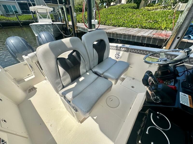 2019 Wellcraft 262 Fisherman boat interior with dual seats and steering console.