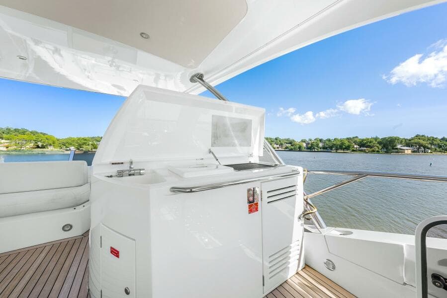 Sunseeker Manhattan 65 yacht deck with scenic water view, 2016 model.
