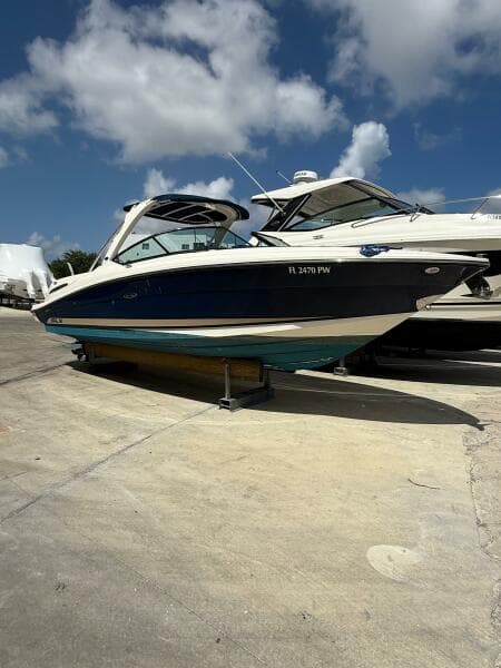 2014 Sea Ray 270 SLX boat on a sunny day at a marina.