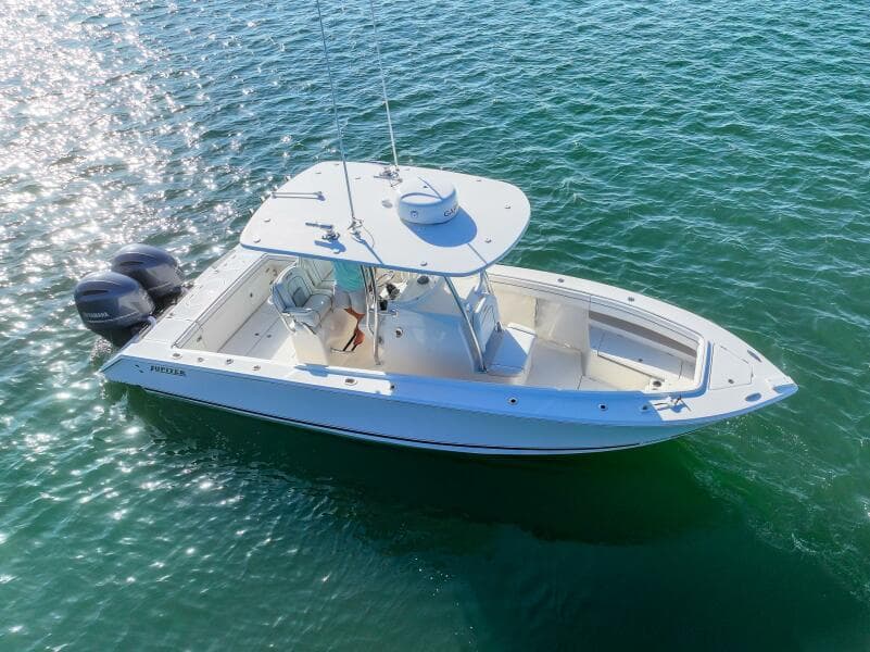 2018 Jupiter 26 FS boat on clear blue water, aerial view.