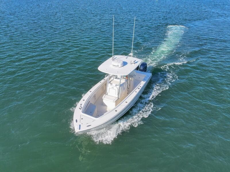 2018 Jupiter 26 FS boat cruising on open water, aerial view.