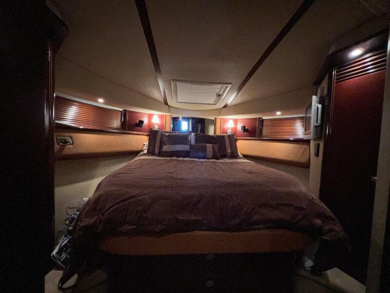 Luxurious bedroom interior of 2005 Sea Ray 500 Sedan Bridge yacht.